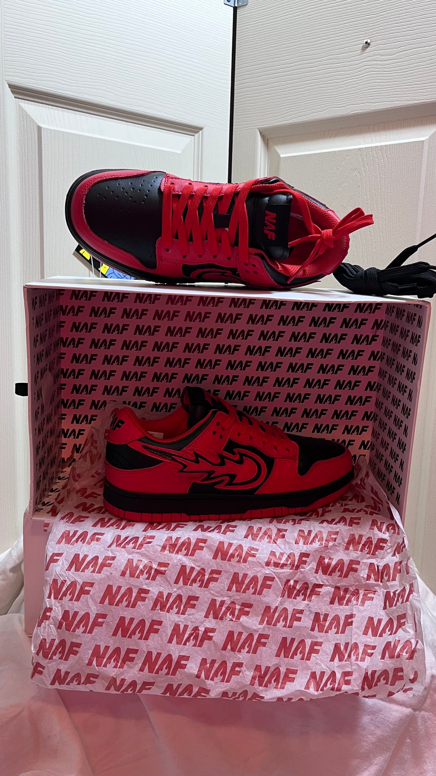 Side profile of NAF Global Vampire Red Stolen Van Edition sneakers, size 6, showcasing vibrant red colorway and rare design