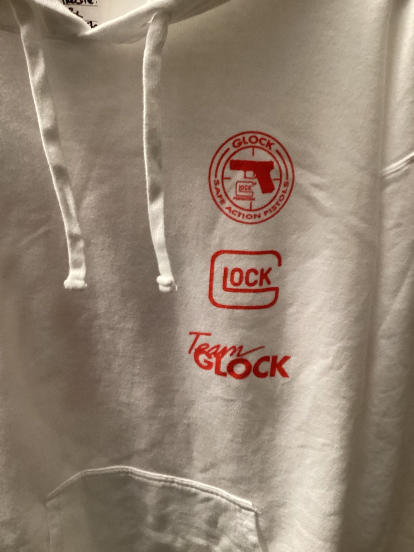 Close-up of GLOCK logo on white hoodie limited drop edition, size large from ShAesthetics