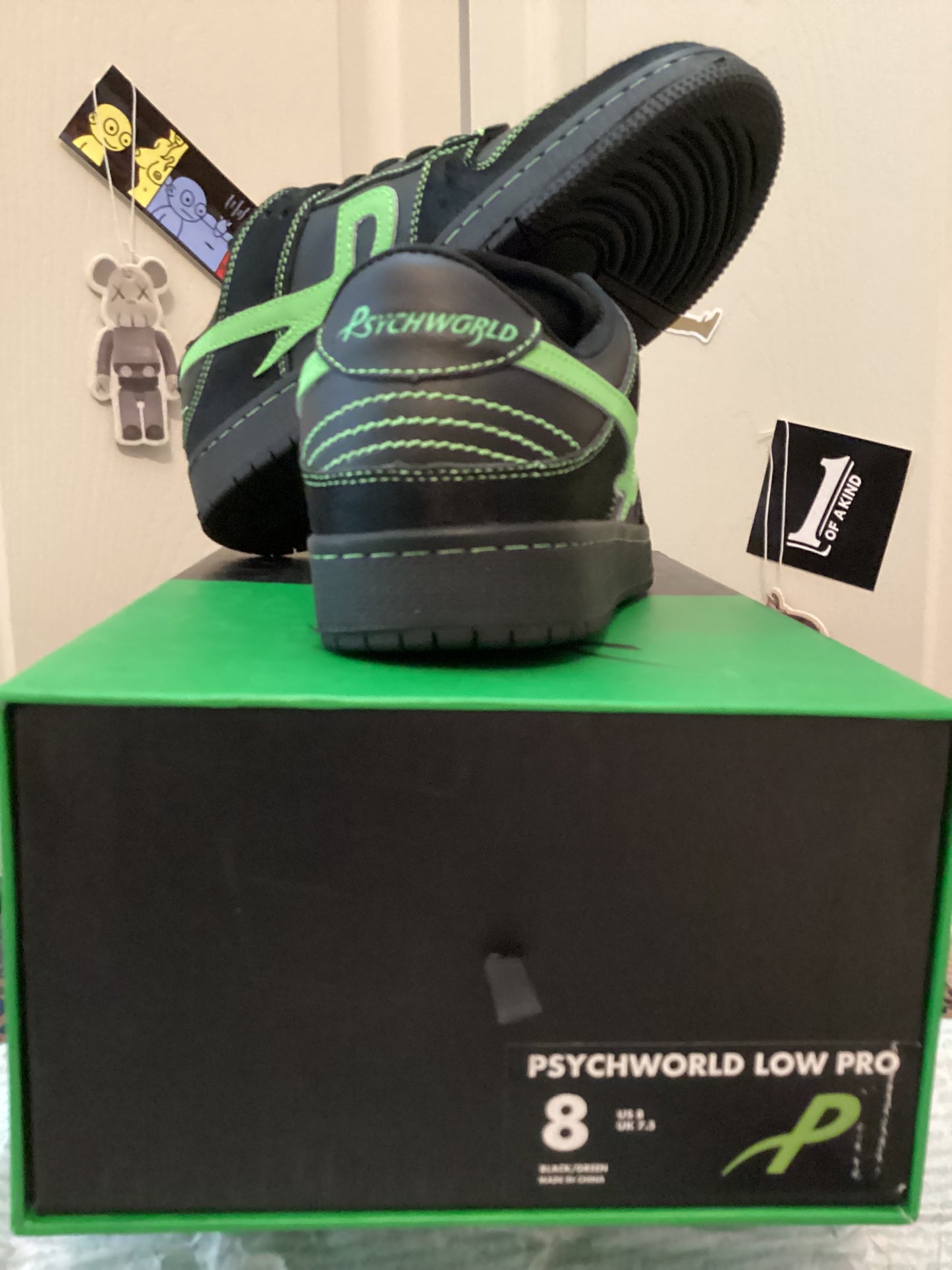 Back view of Psychworld Low Pro Sneakers in black/green, men’s size 8, displayed with original box featuring size label and logo from ShAesthetics