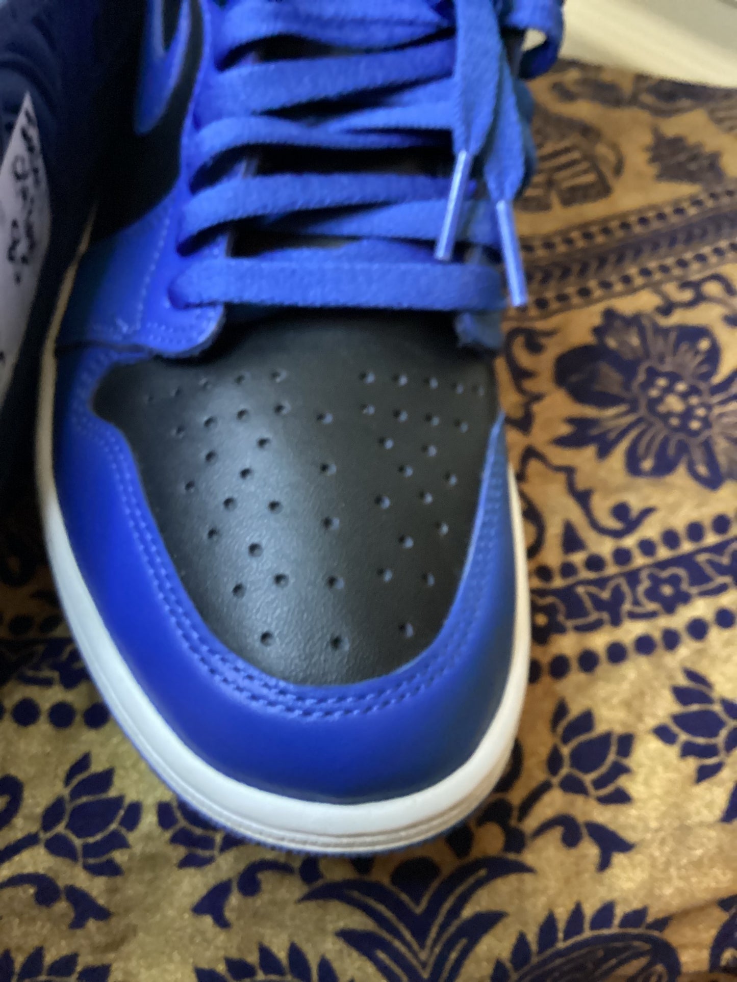 Close-up of the toe box on Air Jordan 1 Retro High OG Royal sneakers size 8.5, showing smooth leather and stitching detail from ShAesthetics