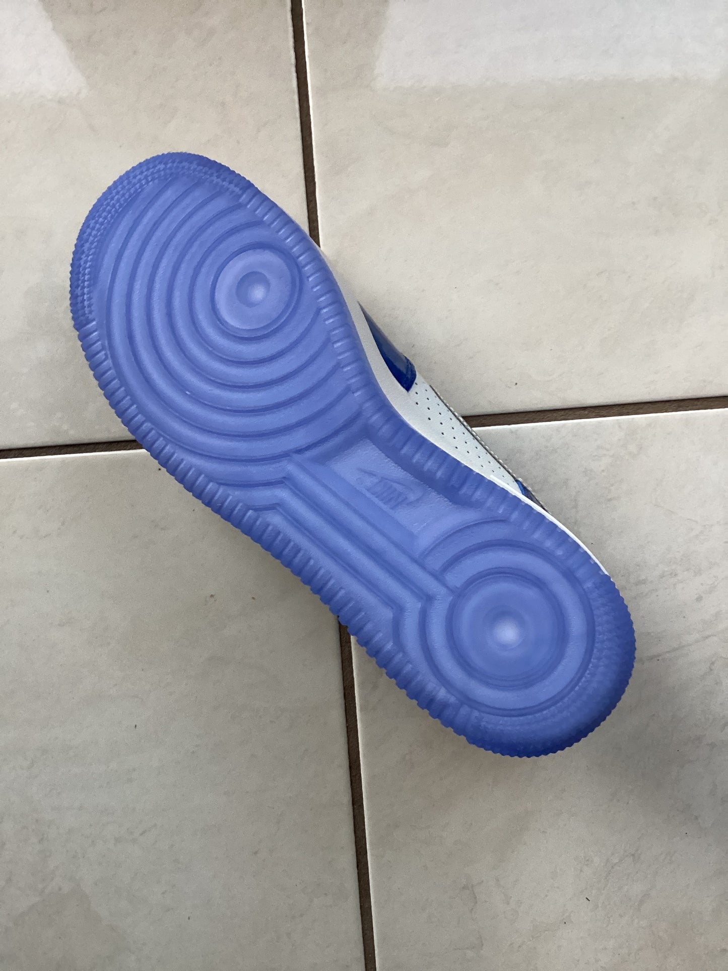 Bottom sole of Nike Air Force 1 ‘07 LV8 Light Photo Blue Multicolor sneaker – durable tread design men’s size 9.5 from ShAesthetics