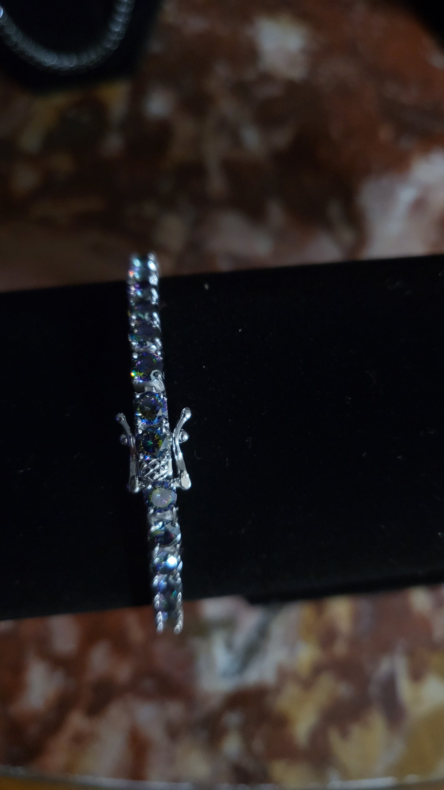 Close-up of 7.5” mystic topaz tennis bracelet with 15ct rainbow gemstones in 925 sterling silver