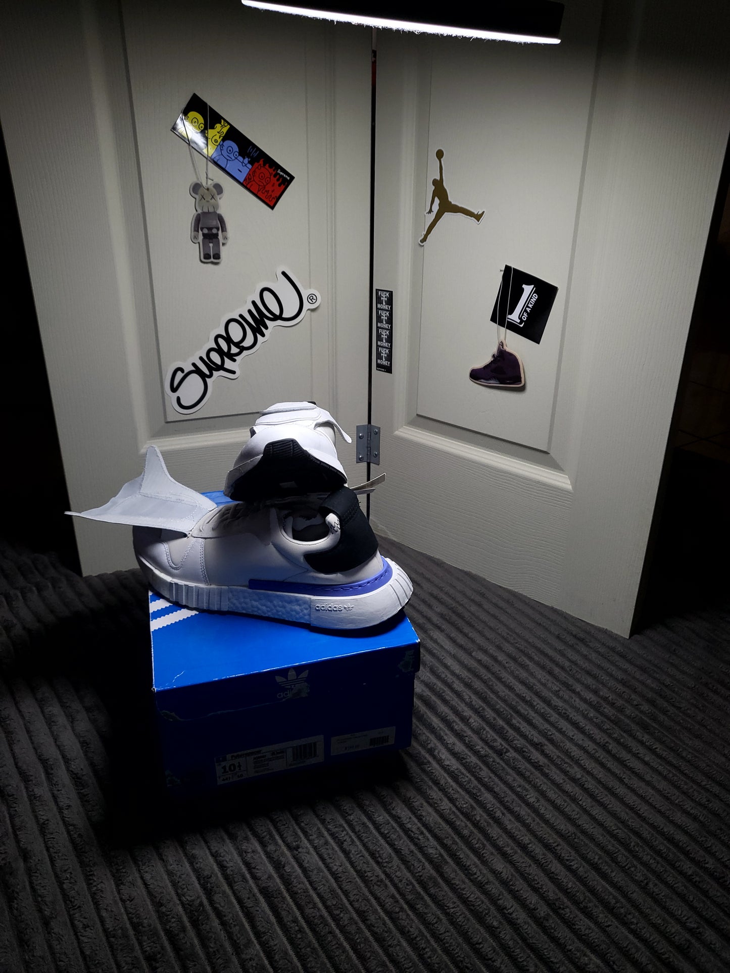 Sleek Adidas Micropacer x NMD R1 “Triple White” shoes in size 10.5, blending vintage tech inspiration with modern NMD comfort from ShAesthetics
