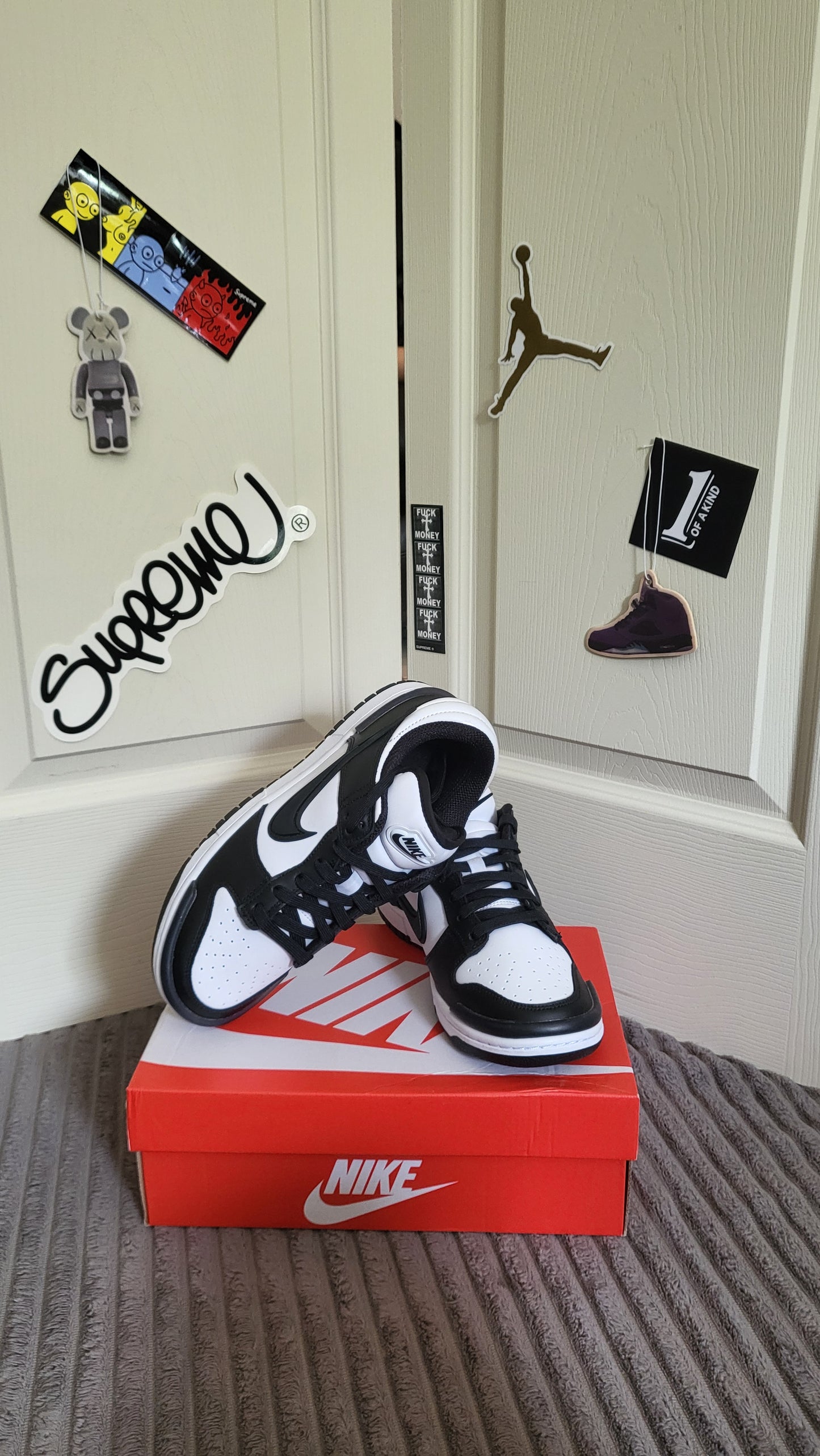 Nike Dunk Low Twist Panda in black and white sitting on original Nike box