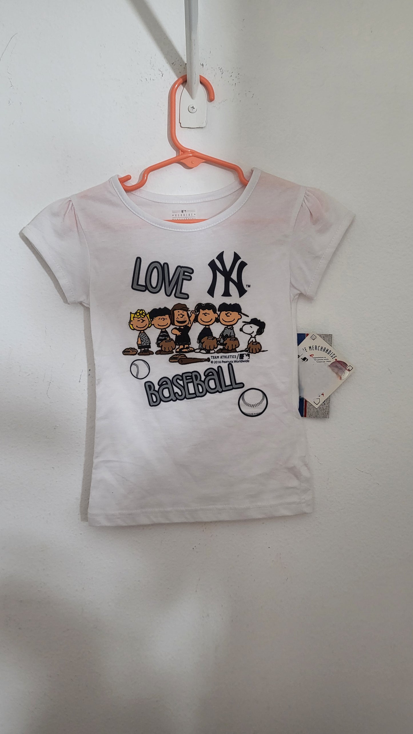 Front of white Peanuts x MLB Yankees toddler t-shirt with Charlie Brown and Snoopy graphic and ‘Love Baseball’ text