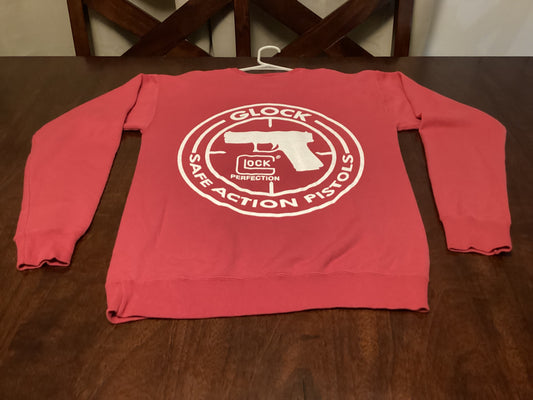 Vibrant red Team Glock Crewneck Sweatshirt in size small, featuring Safe Action Heat design—perfect blend of comfort and streetwear style from ShAesthetics