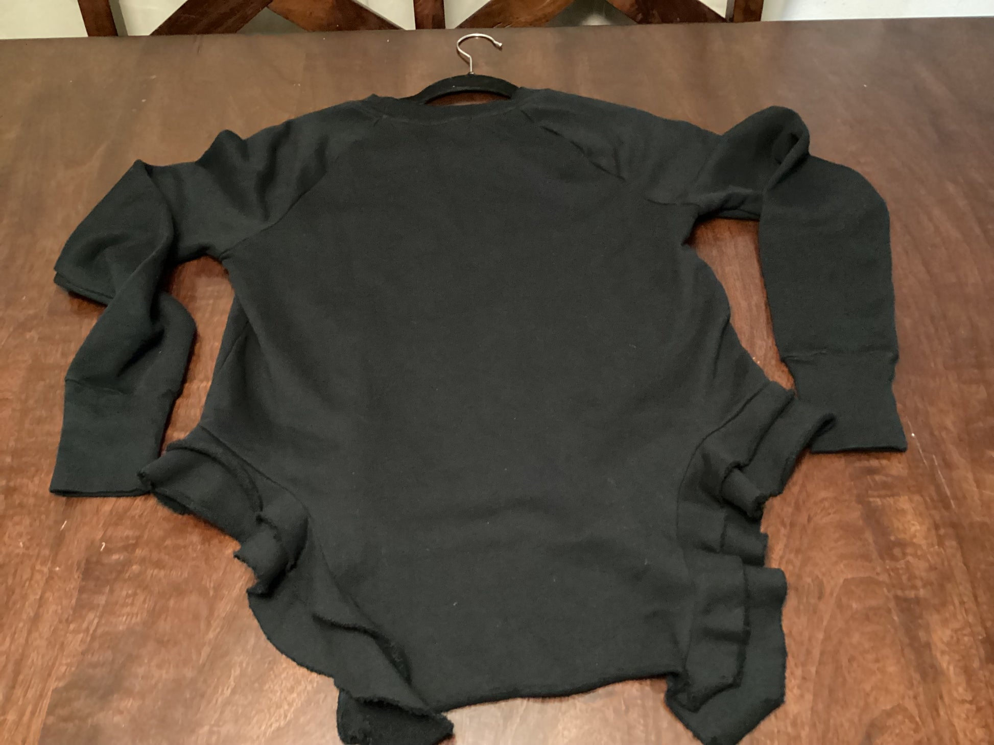 Front view of Black Orchid LA Double Ruffle Sweat Sweater in jet black, size small, combining cozy comfort with elegant double ruffle design from ShAesthetics