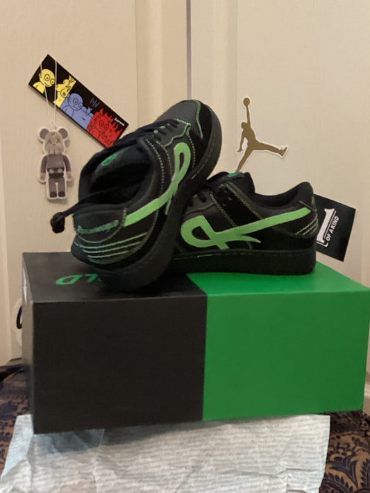 Closeup of Psychworld Low Pro black and green sneakers showing detailed stitching and design, men’s size 8