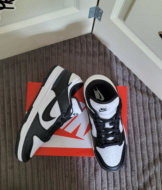 Nike Dunk Low Twist Panda in black and white sitting on original Nike box