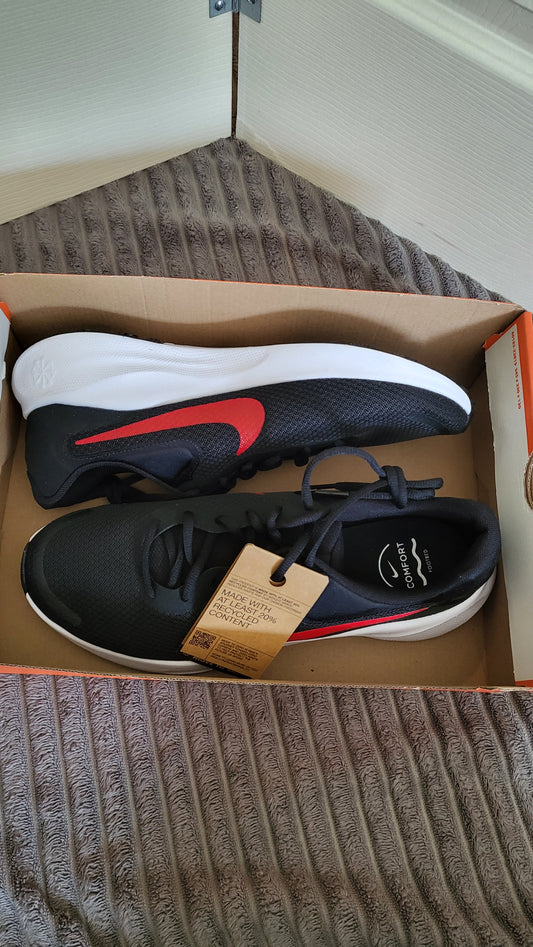 Nike Revolution 7 in black with red swoosh, brand new inside Nike box without a lid.
