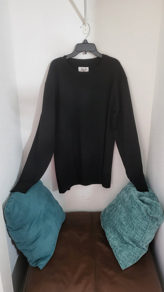 Front view of black Melrose Place waffle knit long sleeve shirt, size M, hanging on gray hanger against white wall