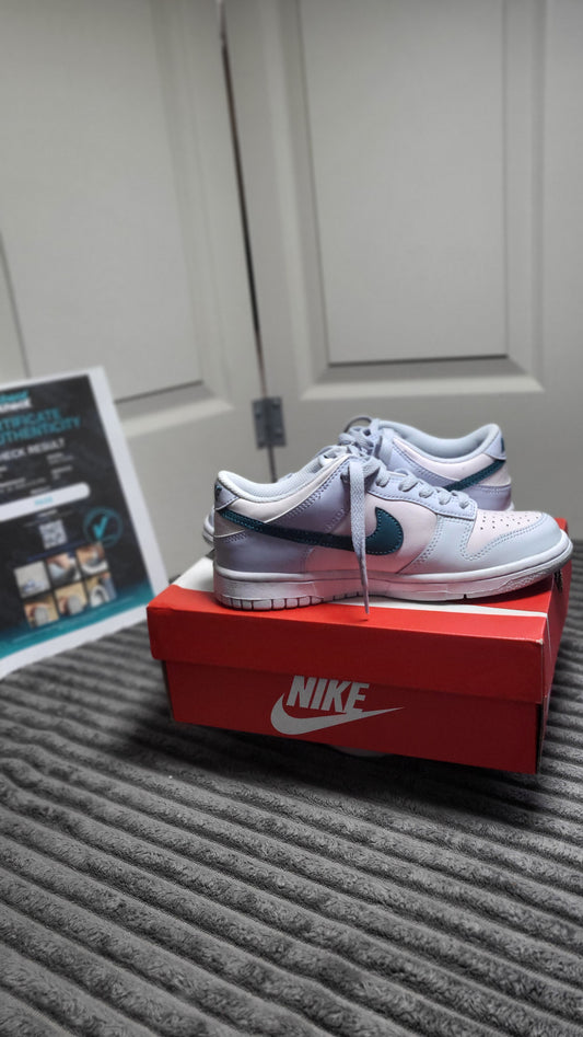 Vibrant Nike Dunk Low (GS) “Pink Foam / Teal Nebula” size 5Y sneakers, perfect for youth with a mix of soft pastels and strong presence, available at ShAesthetics