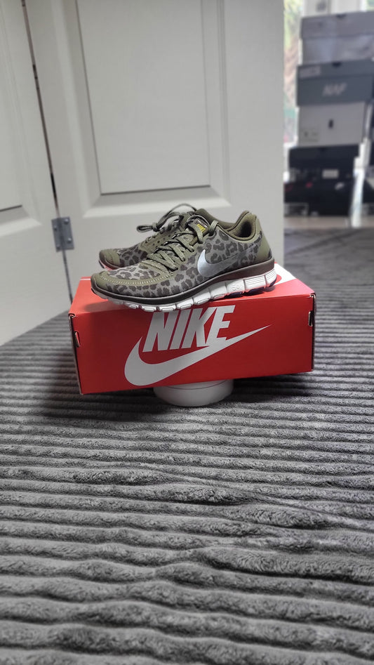 Nike Free 5.0 V4 sneakers in size 5, featuring bold olive leopard camo print, Gym Catwalk Certified for stylish athletic performance from ShAesthetics