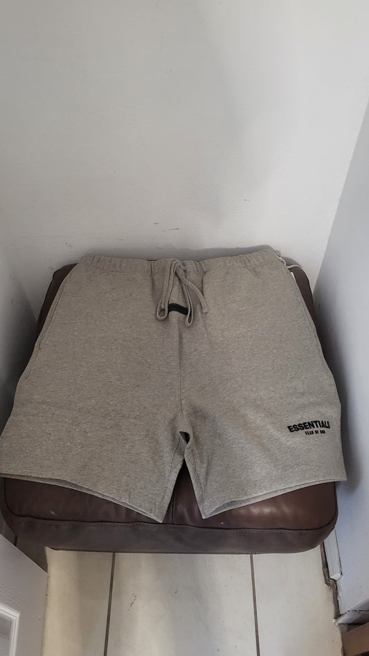 Fear of God Essentials heather grey sweat shorts with logo on left leg, size XL