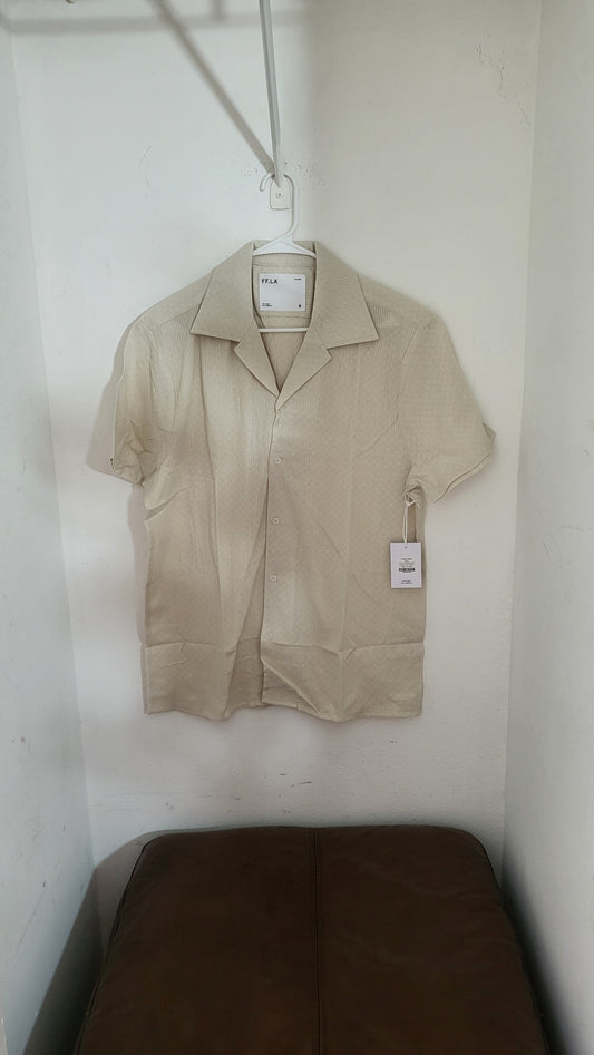 FF LA Cyrus cream short-sleeve button-up shirt displayed flat on leather couch, size L with hang tag visible