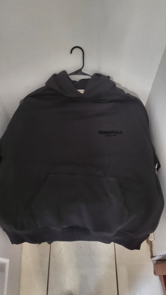 Fear of God Essentials hoodie in Stretch Limo black, size XL with tonal logo