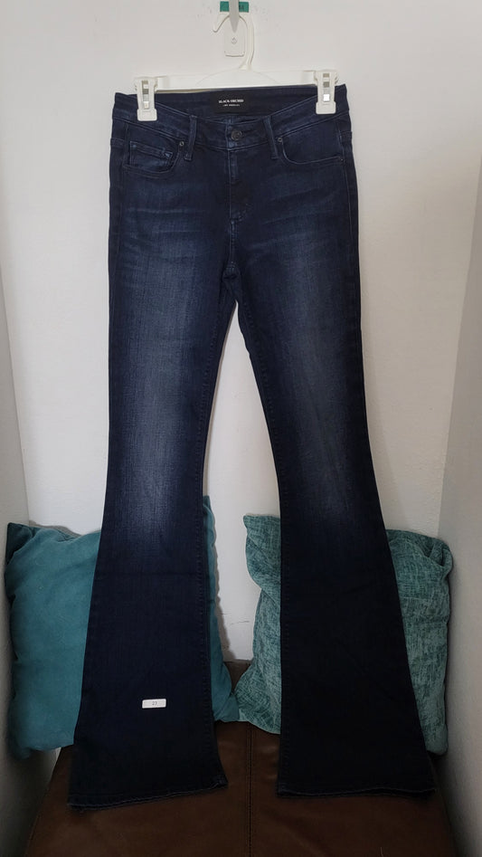 Black Orchid Mia Mid Rise Skinny Flare jeans in classic black, combining a sleek skinny fit with a stylish flare for a modern look from ShAesthetics